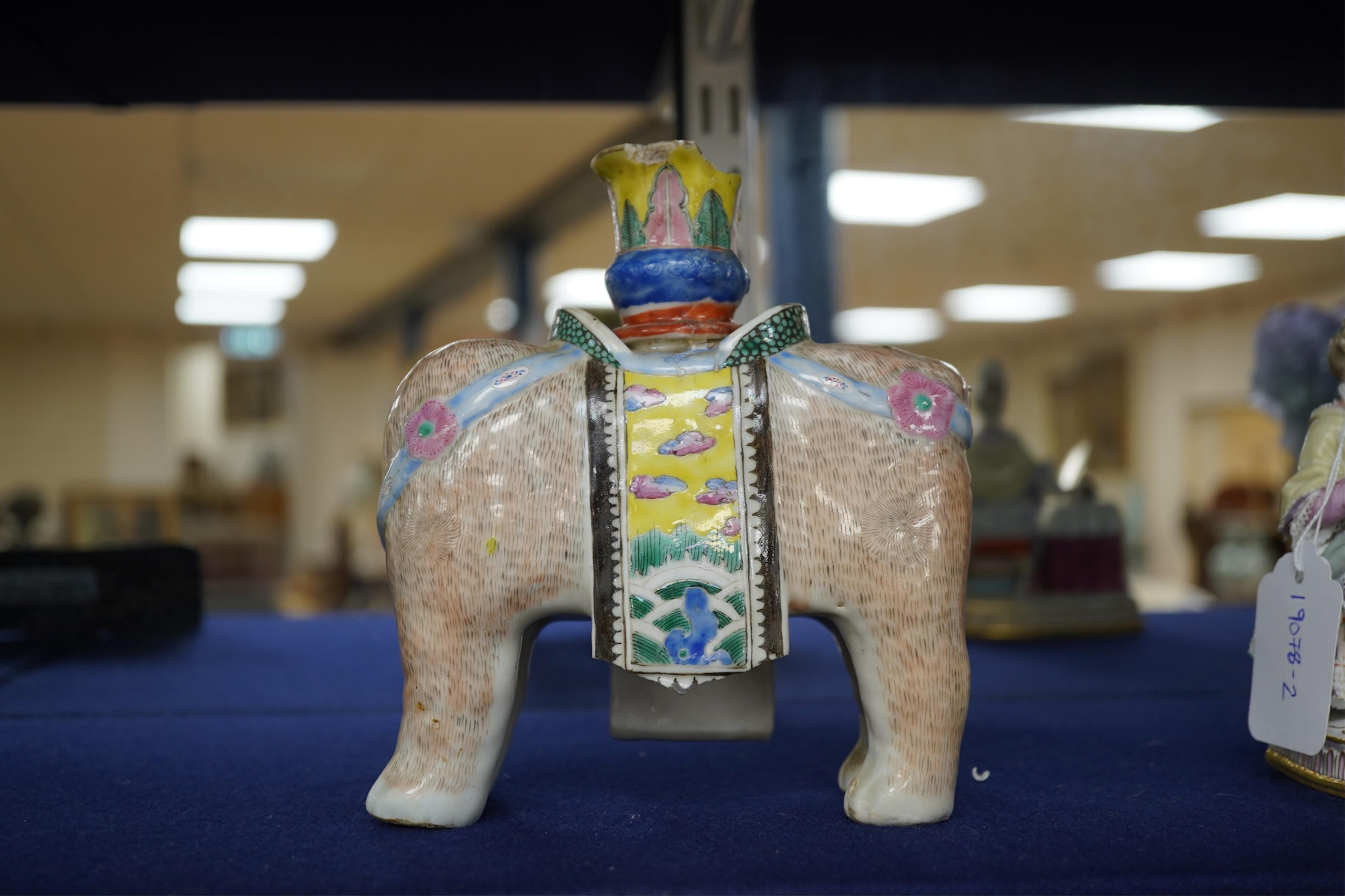 A 19th century Chinese enamelled porcelain vase in the form of an elephant with a howdah on its back